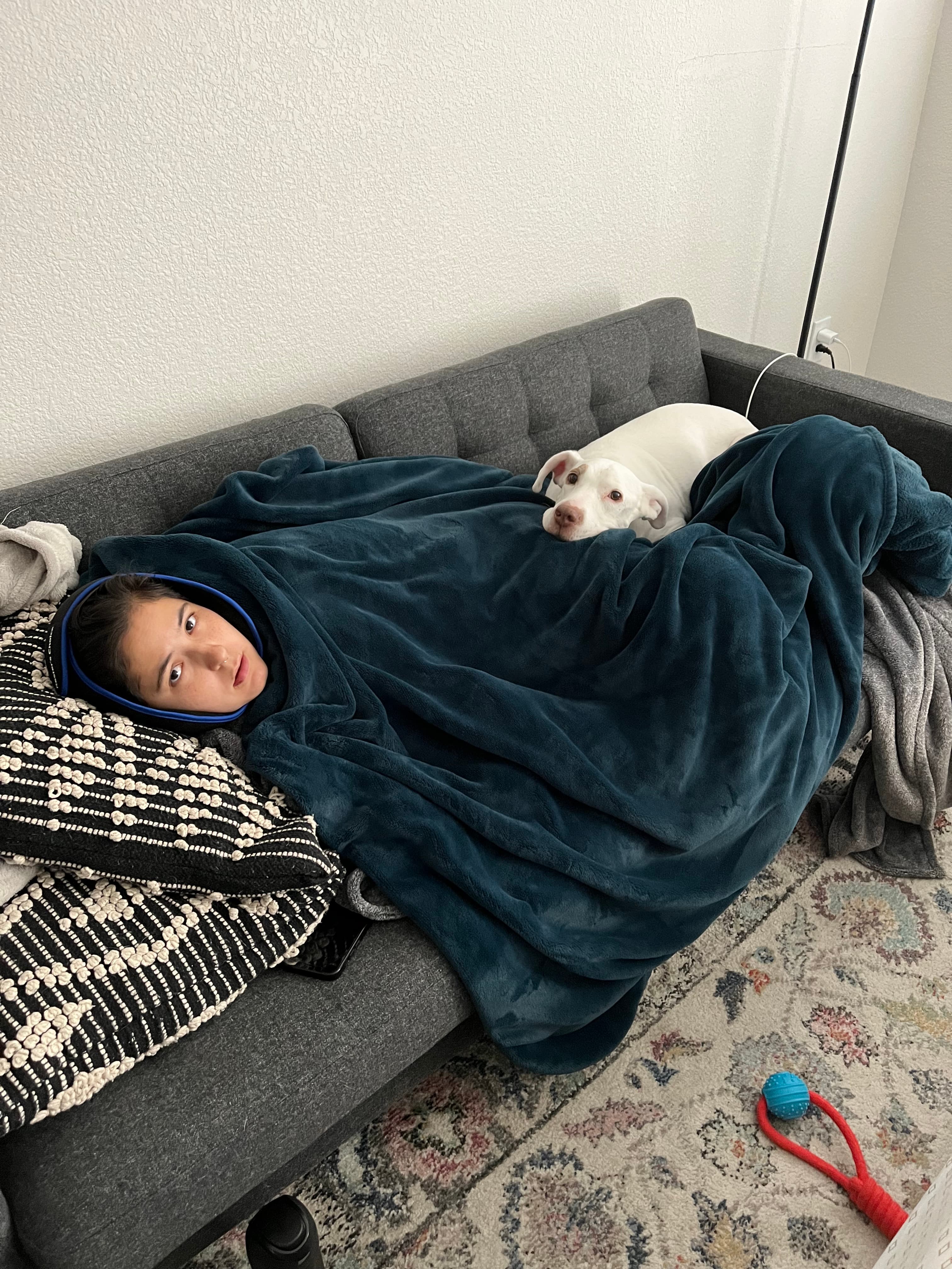 Steph and Nala on the couch after wisdom teeth removal